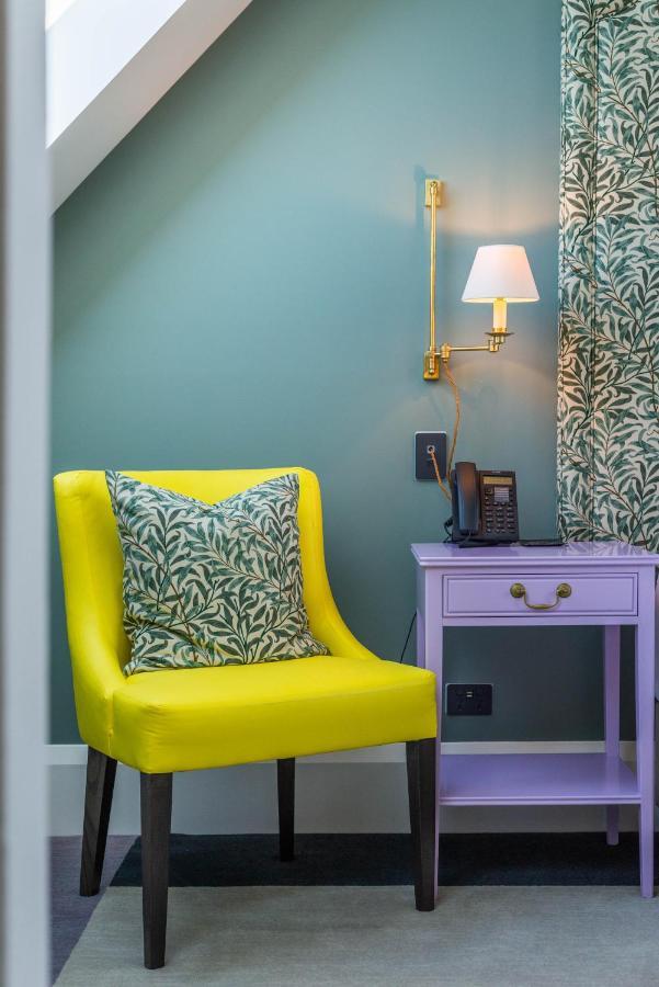 The Observatory Hotel Christchurch Bagian luar foto A chair in a hotel room